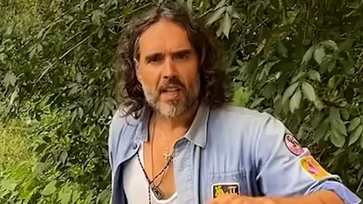 Russell Brand flogs 180 ‘magical amulet’ which he insists will protect fans from ‘Wi-Fi and evil energies’ in airports [Video]