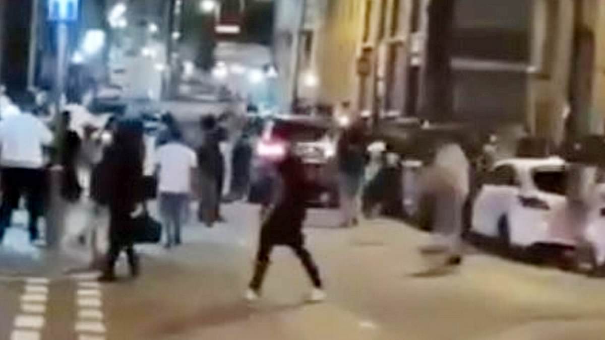 Horrifying moment car ploughs into crowd during brawl outside Freshers’ Night club event that left six injured [Video]