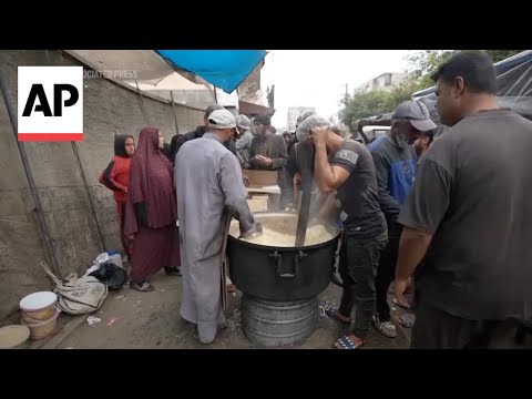 Palestinian children line up in Gaza Strip hoping to be distributed a warm meal [Video]